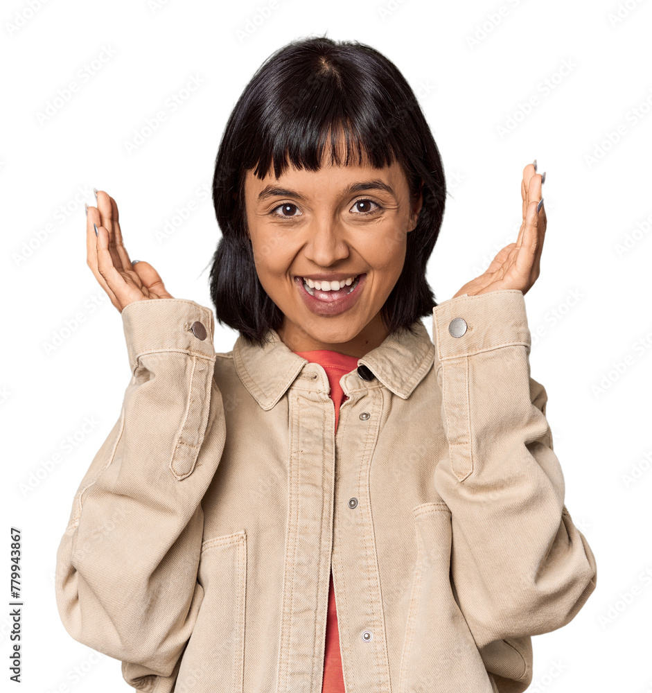 Poster Young Hispanic woman with short black hair in studio joyful laughing a lot. Happiness concept.