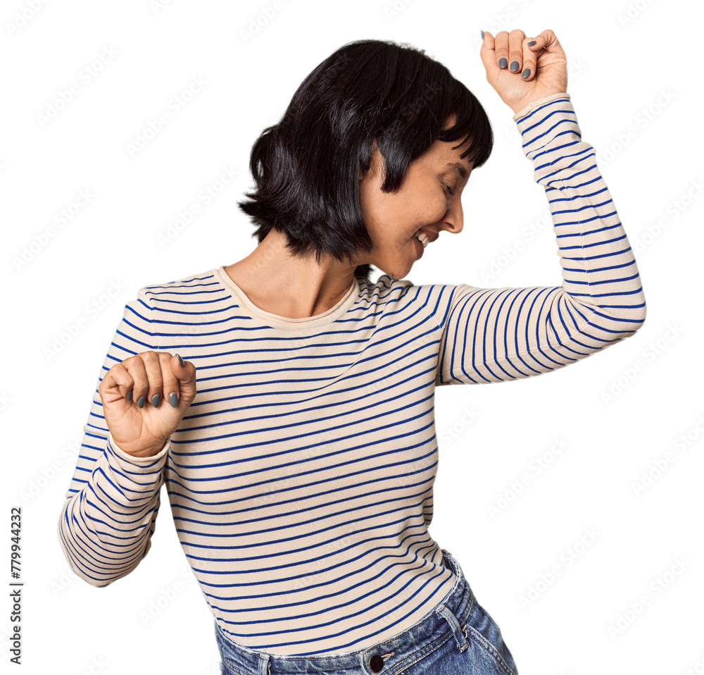 Poster Young Hispanic woman with short black hair in studio celebrating a special day, jumps and raise arms with energy.