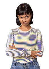 Young Hispanic woman with short black hair in studio unhappy looking in camera with sarcastic...