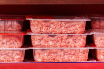 Pile of Plastic Meat Containers meat, ready for processing or distribution in a food industry setting