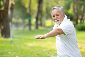 asian senior man workout and static stretching in the park