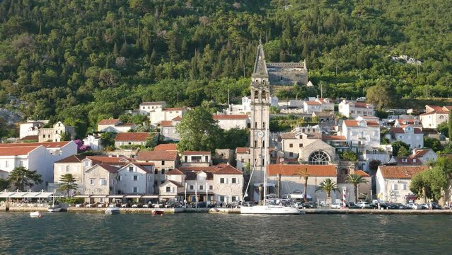 The old town of Perast in the Bay of Kotor. Shooting video from a moving boat.