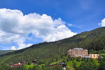 Buildings and houses in the forest on the mountain Bad Gastein summer season - 779968478