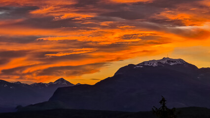 Scenic view of snow capped mountain peak Dobratsch at sunset seen from Taborhoehe in Carinthia,...