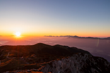 Scenic sunrise view from summit Dobratsch on Julian Alps and Karawanks in Austria, Europe....