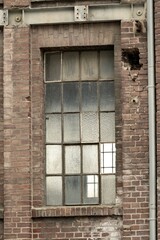 Details of an old industrial building, brick wall and windows, approx. 100 years old