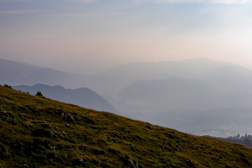 Scenic view from summit Dobratsch on Julian Alps and Karawanks mountain ranges in Carinthia, Austria, Europe. Jagged sharp peaks in Austrian Alps. Wanderlust tranquil atmosphere in alpine wilderness