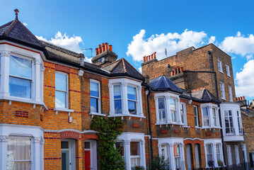 Front view of traditional Victorian and Georgian brick houses in Greenwich area in South - East London, United Kingdom