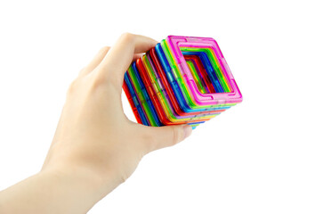 A group of colorful transparent magnet squares (puzzle game for kids) connected into a tunnel in a...