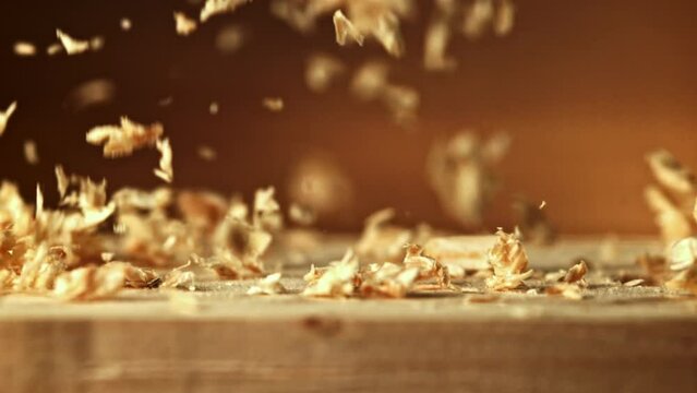 Super slow motion sawdust falls on the table. High quality FullHD footage