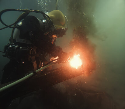 Commercial diver welding and cutting underwater