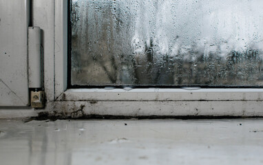 condensation on the window. water flows down from the window glass