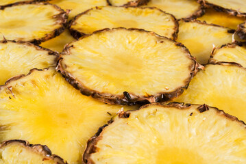 Fresh ripe sliced pineapple closeup - 779991019
