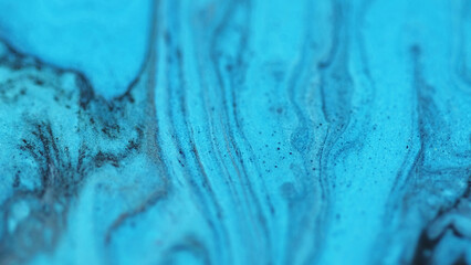 Ink drip flow. Glitter acryl texture. Blur bright blue black color wave wet shimmer serum sparkling...