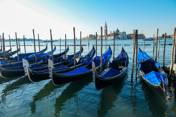 Group of gondolas moored by Saint Mark square in city of Venice, Veneto, Northern Italy, Europe....