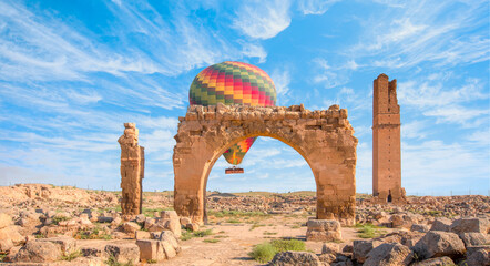 Hot air balloon flying over spectacular Mesopotamia - Ruins of the ancient city of Harran - Urfa, Turkey