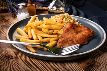 Fried cod fillet with fries and salad. - 780000014