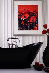 Black bathtub and red roses with a framed picture of red poppies in a modern bathroom