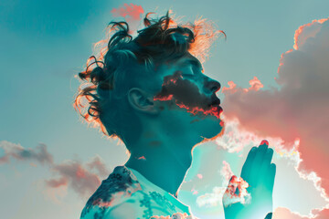 Young man praying against the sky with clouds and light, image in double exposure style. - obrazy, fototapety, plakaty