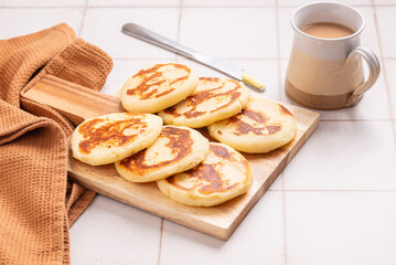 arepas con queso, the traditional Colombian cornmeal pancakes with butter