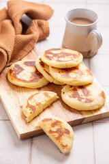 arepas con queso, the traditional Colombian cornmeal pancakes with butter