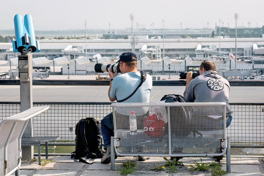 Photographers taking pictures of aircrafts at Munich airport: Munich, Germany - September 15, 2018