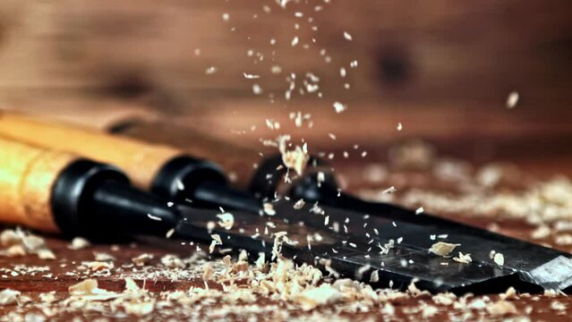 Super slow motion sawdust falls on the table. High quality FullHD footage