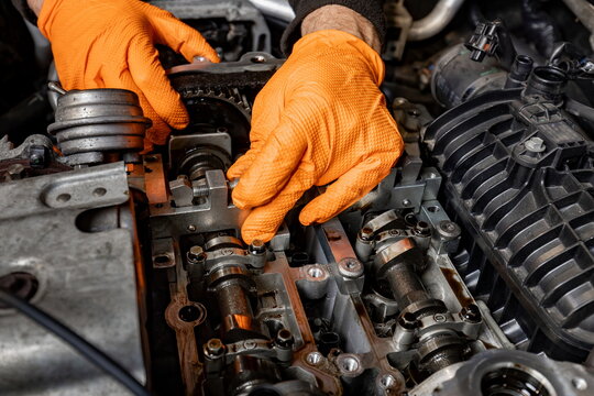 Skilled Hands Repairing a Car Engine