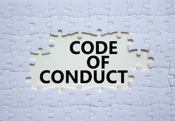 Code of conduct symbol. White Puzzle with words Code of conduct. Beautiful white background....