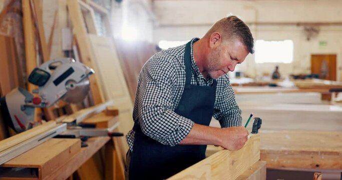 Man, carpenter and wood with drawing at workshop for furniture and design. Mature person, handyman and carpentry for repair on startup business as manager or supervisor with woodwork at warehouse