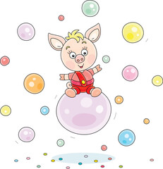 Funny cartoony little piglet riding on a big soap bubble among many other colorful soapbubbles flying around, vector cartoon illustration on a white background