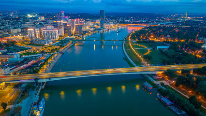 Sunset over Downtown Belgrade viewed behind the Sava river in Se