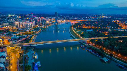 Sunset over Downtown Belgrade viewed behind the Sava river in Se