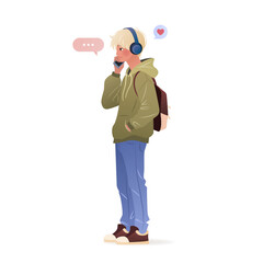 Student in headphones standing and using his smartphone. Male character holding a mobile phone in his hands and talking on it. isolated vector illustration on white background.