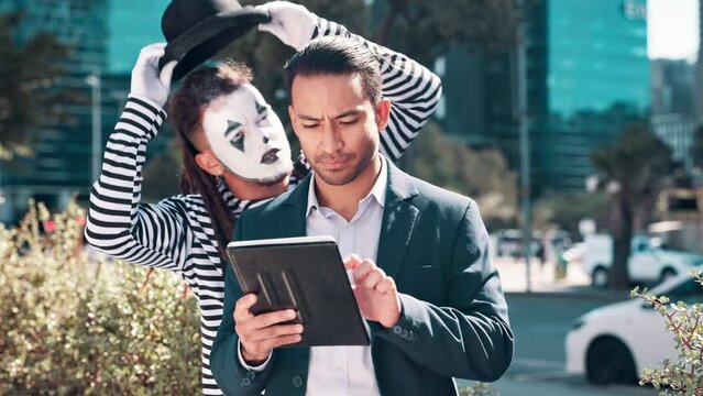 Businessman, tablet and mime in city with mimic for comedy, street performance or funny joke. Male people, actor and technology with thinking for email, networking or idea with comic entertainment