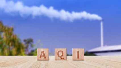 AQI, Abbreviation of air quality index word written on wooden blocks. text AQI on nature...