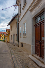 Narrow street in the center of Slovenian town Novo Mesto
