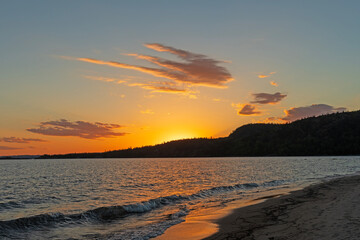 Sun Behind the Cliffs With Quiet Evening Clouds