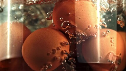Super slow motion eggs boiled in boiling water. High quality FullHD footage - Powered by Adobe
