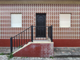 Entrance to a traditional Portuguese house with azulejo tiles, countryside