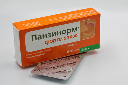 Panzynorm pancreatin pack and blister closeup against white.