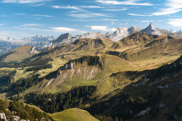Aerial view of Swiss Alps near Fronalpstock in Stoos, Switzerland. Walking trails in mountains. Bright, sunny day.