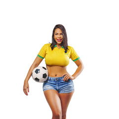 Beautiful young sporty Brazilian woman dressed in sportswear, playing with the ball, soccer and smiling. Isolated on free png background. - obrazy, fototapety, plakaty