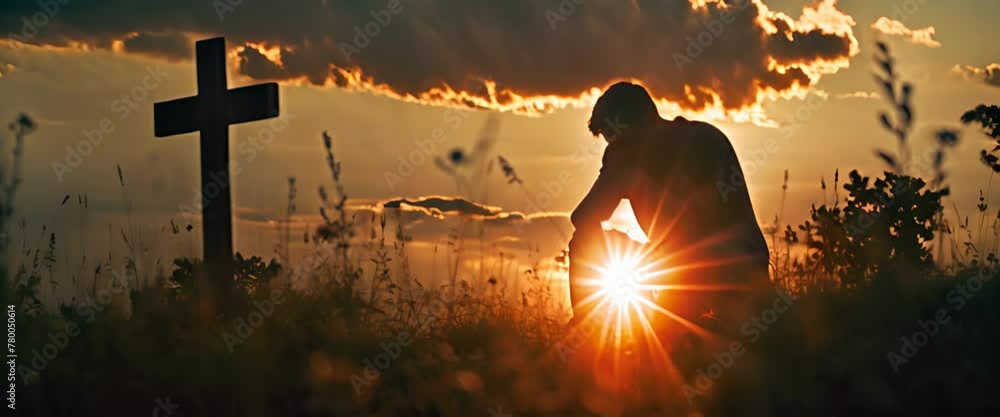 Wall mural christian man praying in front of the cross