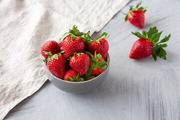 Organic Red Strawberries in a Bowl, side view.