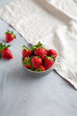 Organic Red Strawberries in a Bowl, side view.