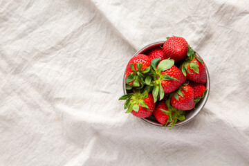 Obraz na płótnie Canvas Organic Red Strawberries in a Bowl, top view. Copy space.
