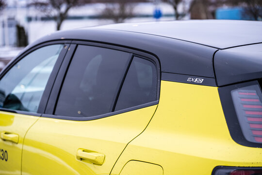 Gothenburg, Sweden - February 11 2024: C pillar badge of a yellow Volvo EX30 electric car.