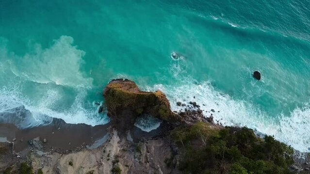 waves breaking on the rocks of Costa Rica, drone view