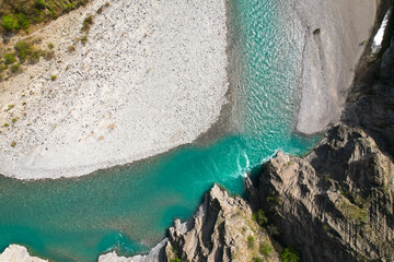 Aerial view wild river with green water in central alps in Italy